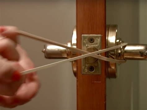 The rubber band will cushion the slamming noise. . Why wrap a rubber band around door lock when alone